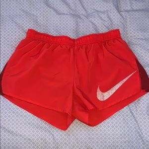 nike orange dri-fit shorts